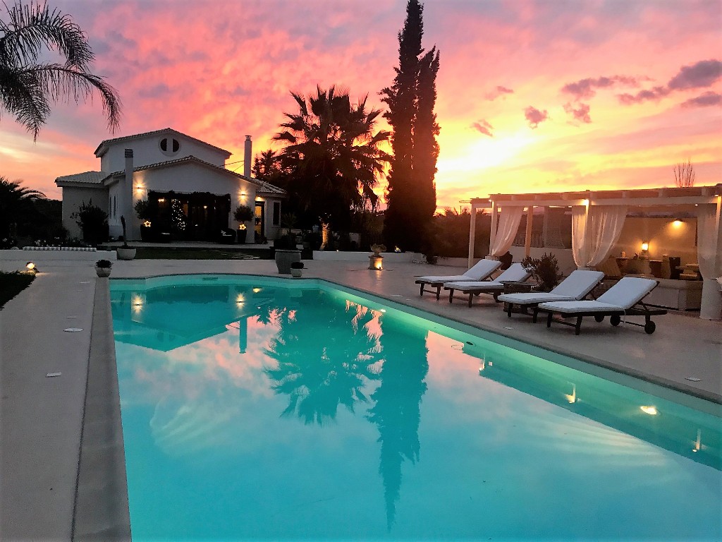 Sunset over the pool at Villa Vravrona Tower